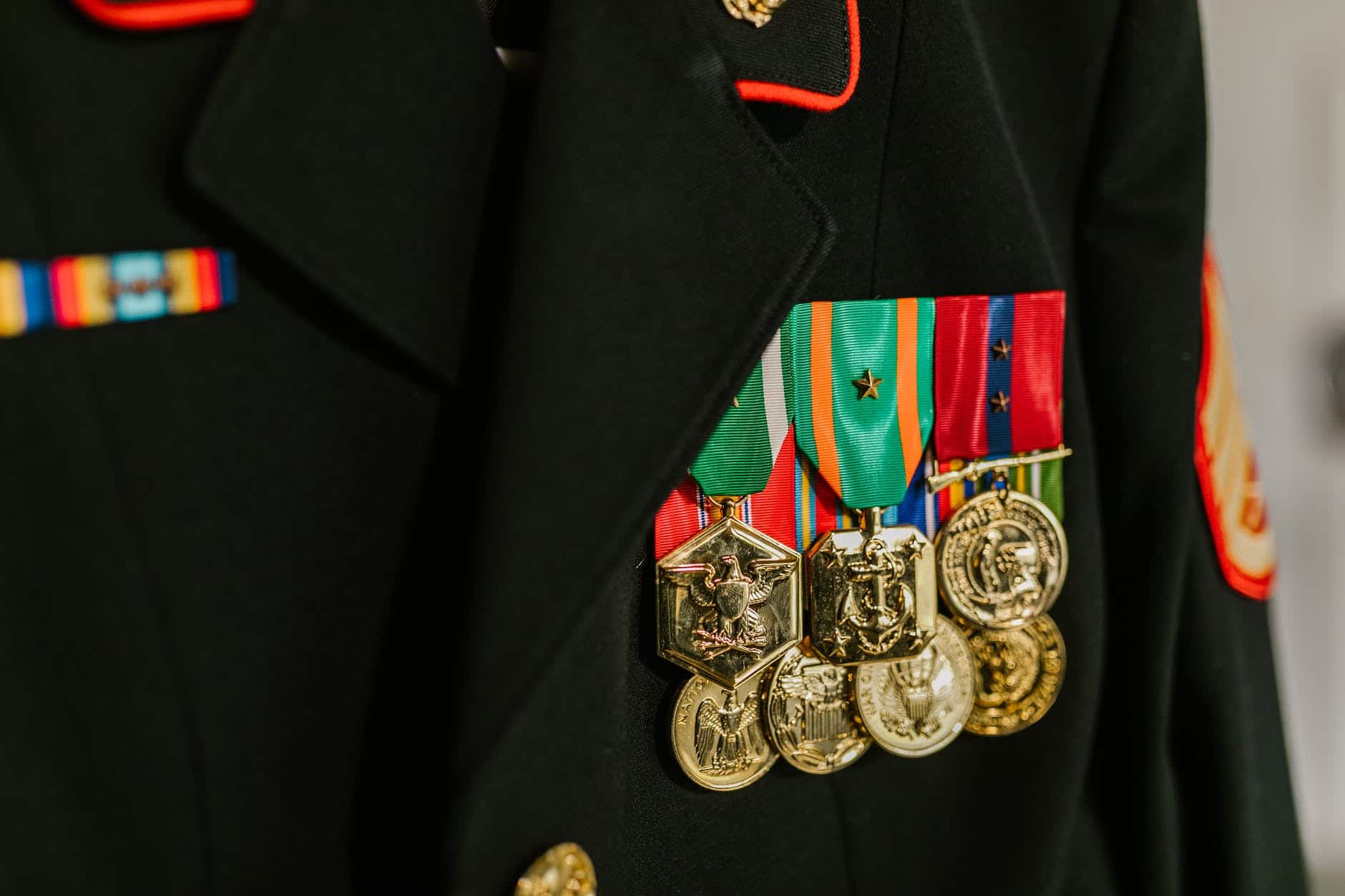 close up photo of navy uniform with gold medals